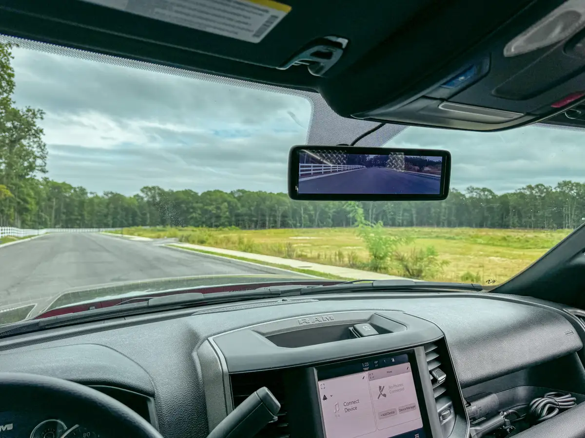 Center-console close-up showing control pads, switches, and gauges.